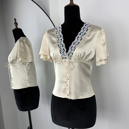 Blusa in raso con pizzo e bottoni a maniche corte