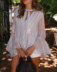 Blusa a righe con volant e fiocco al collo
